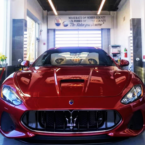Carport with Maserati signage