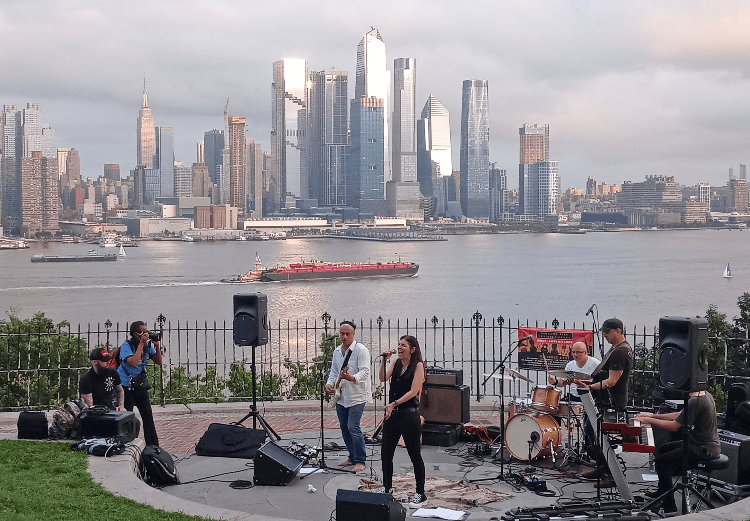 Annie Minogue Band playing in front of the NYC skyline